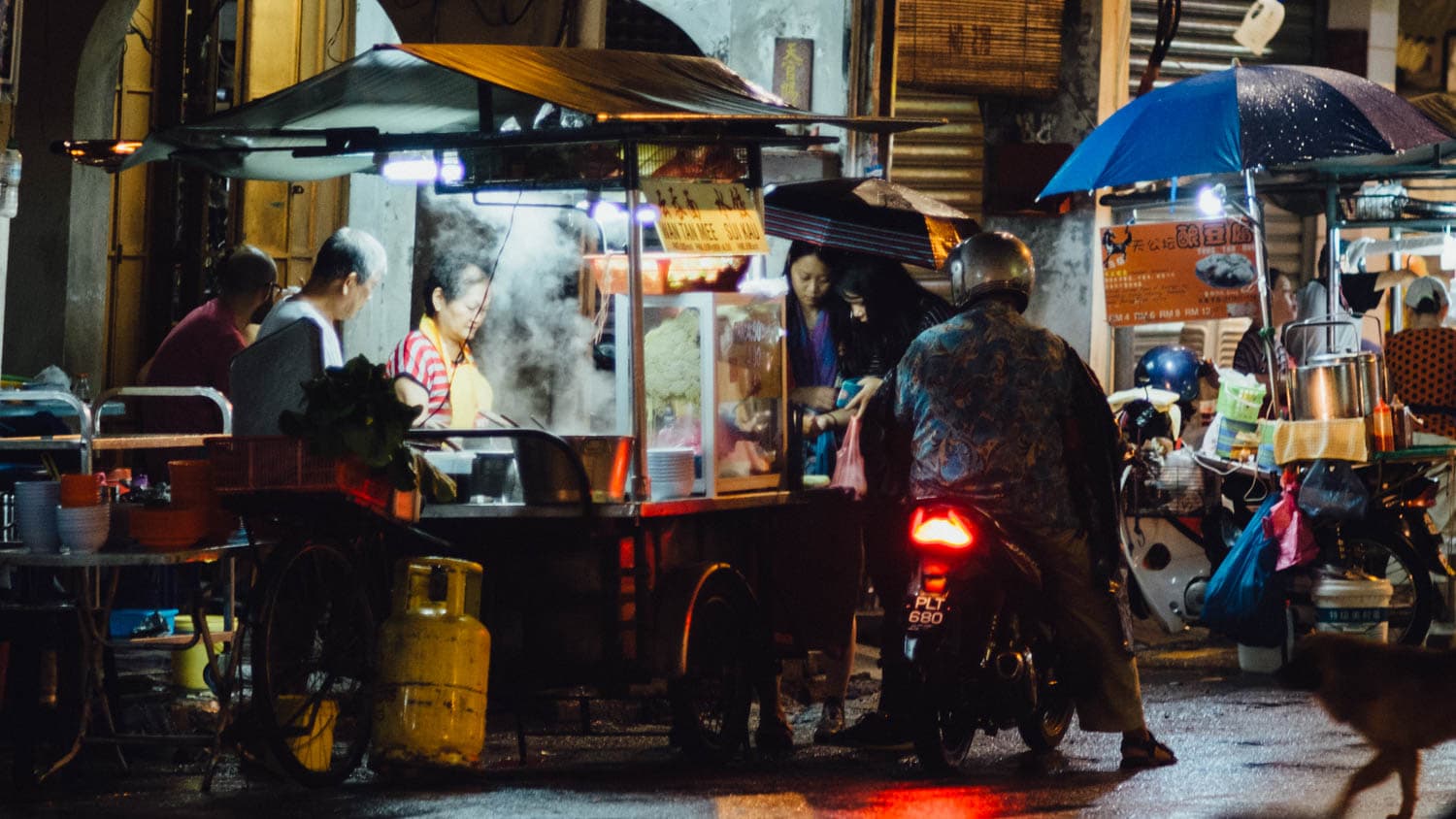 A busy street-food stall at night