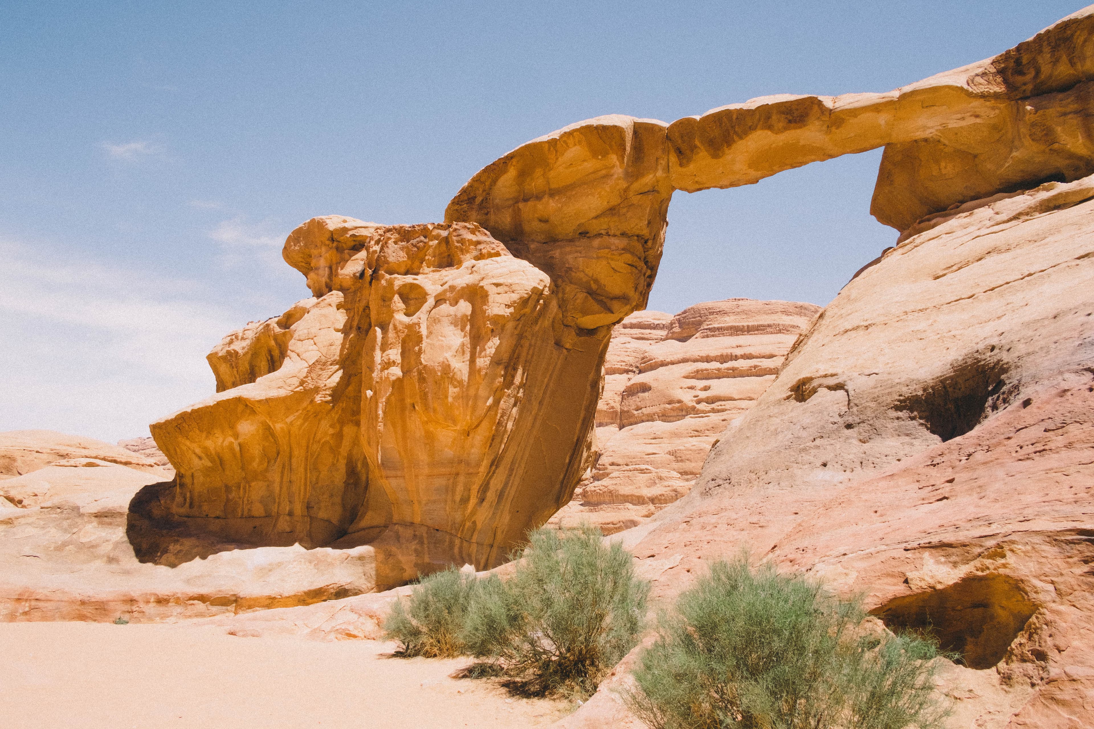 A natural sandstone arch in the Jordanian desert