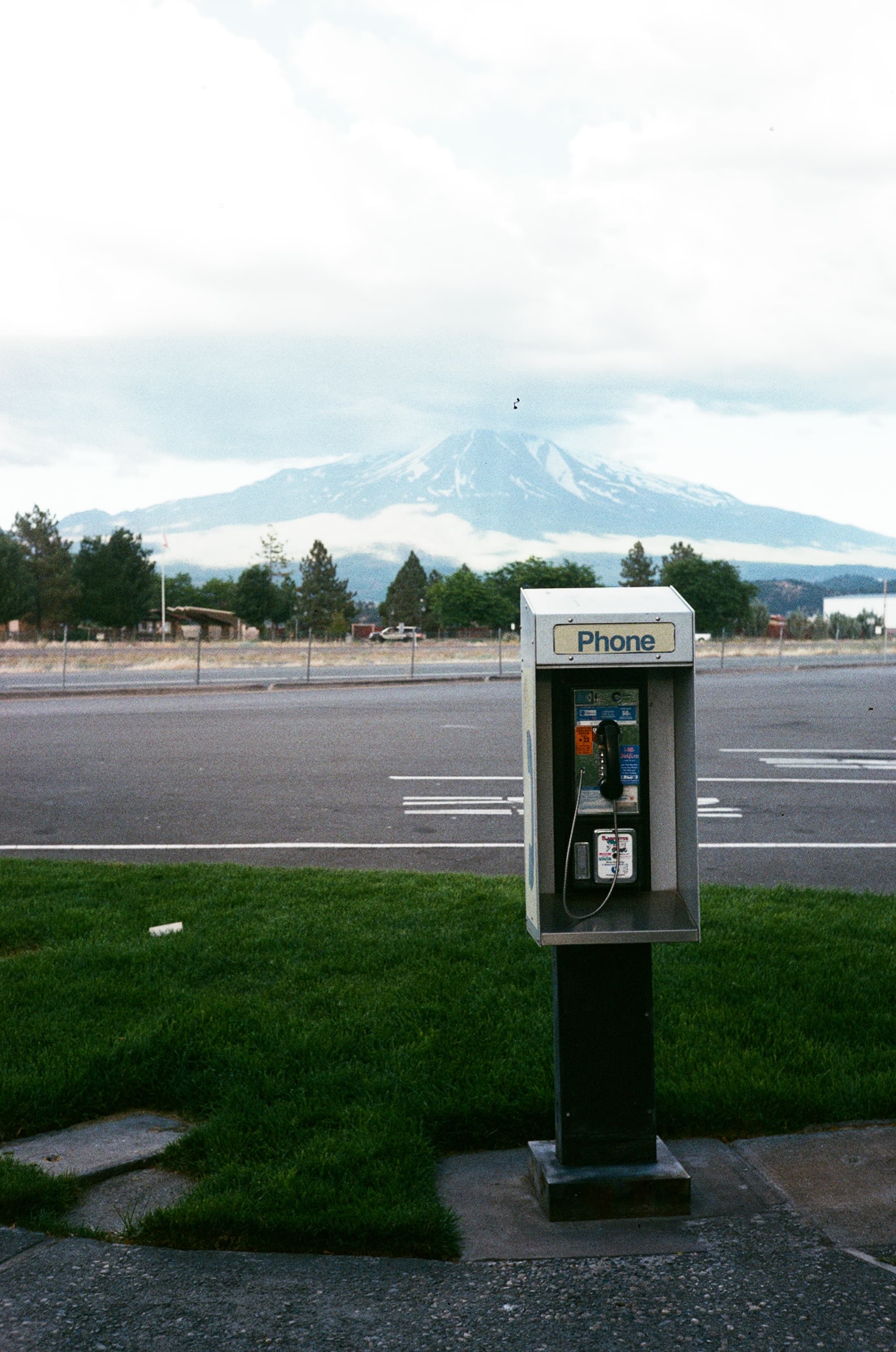 A public telephone beside a coastal road