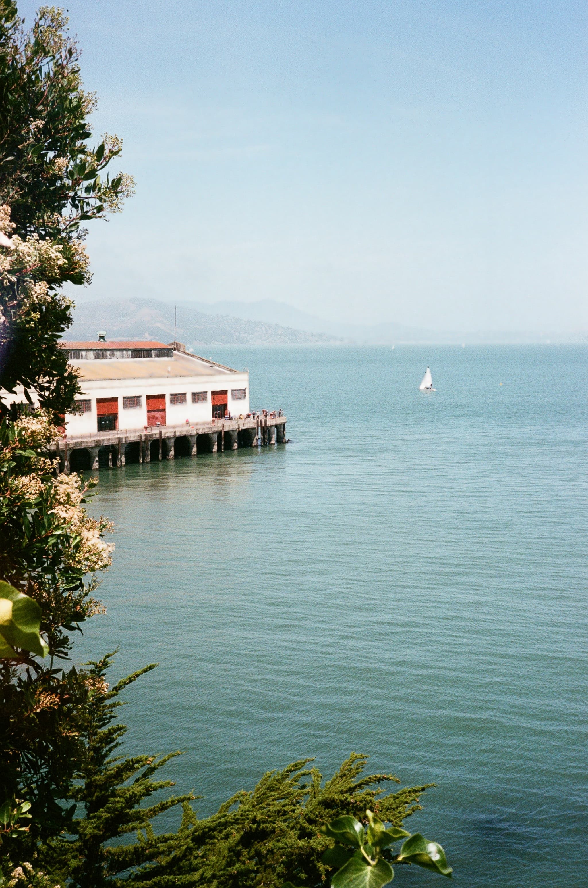 A white building overlooking blue water