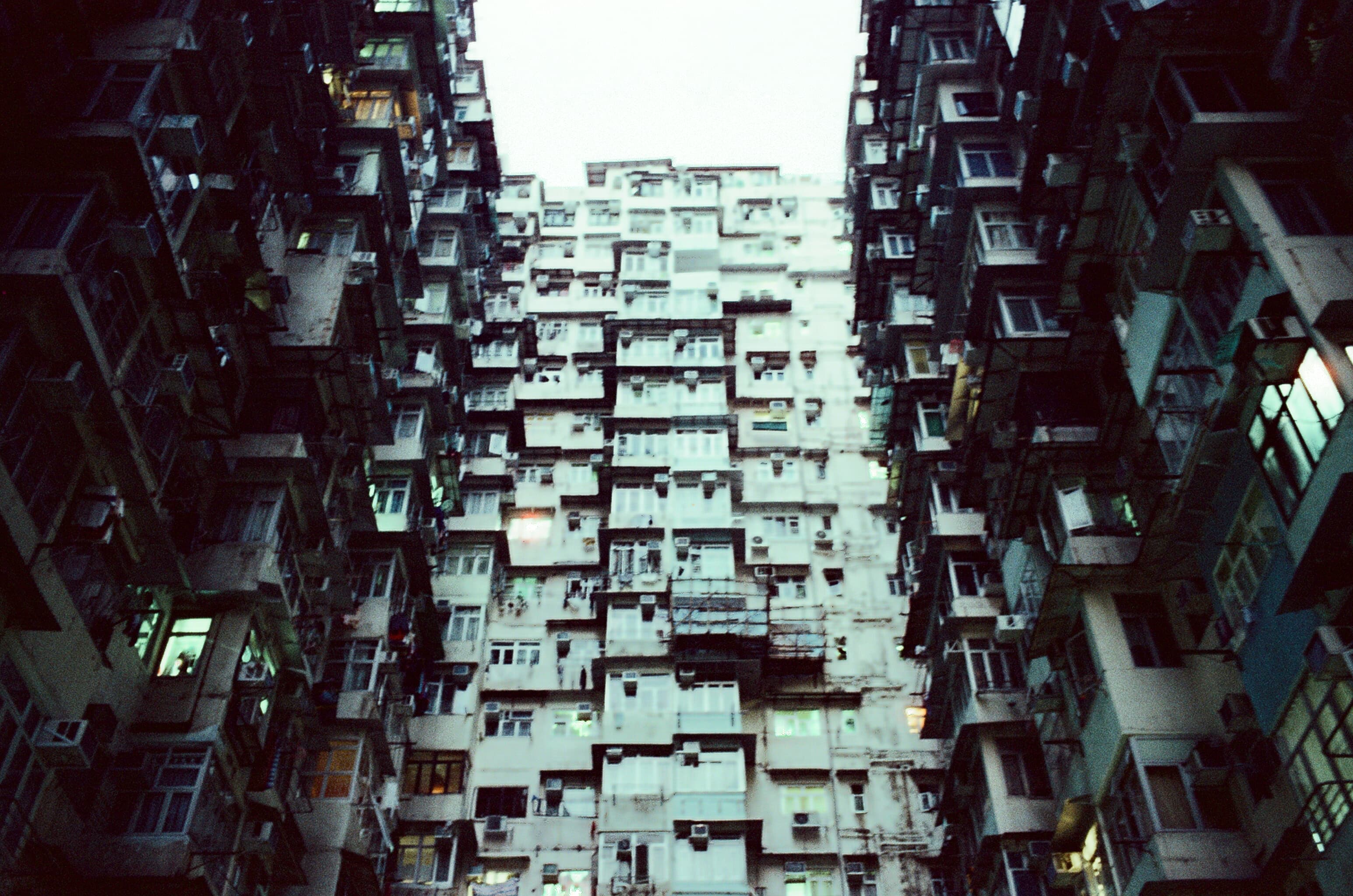 Dense apartment buildings enclosing a narrow courtyard