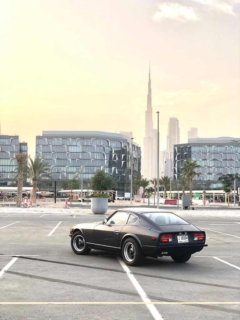 A classic car in an open city car park