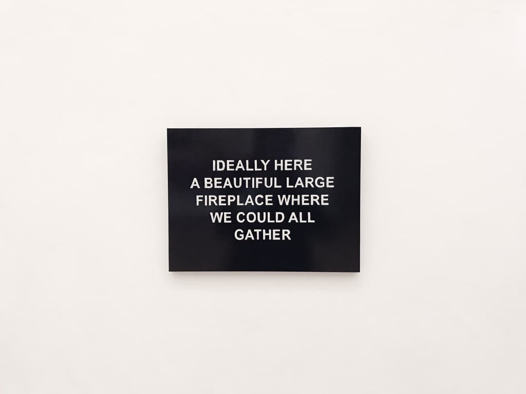A wall sign describing a beautifully large fireplace