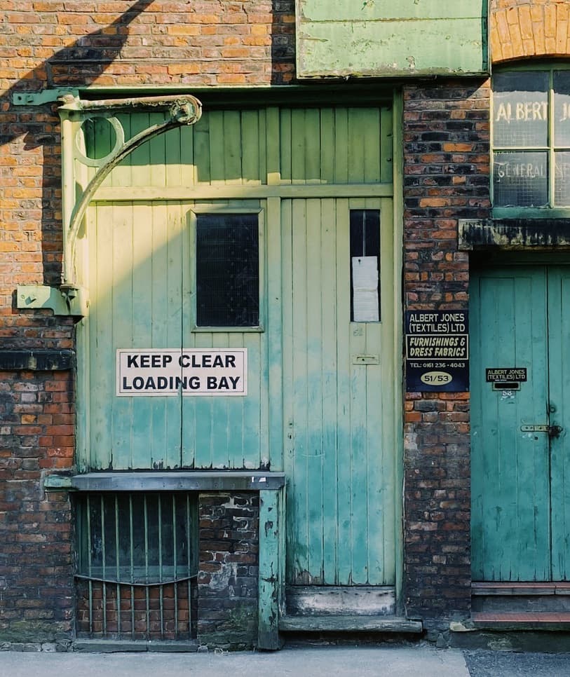 A painted workshop door with a Keep Clear sign