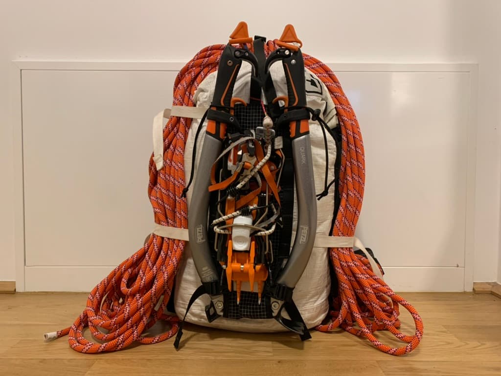 A pack holding neatly coiled climbing ropes